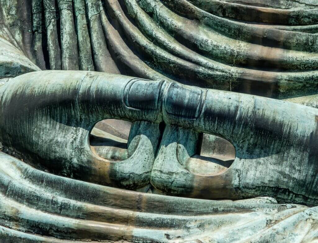 closeup of Buddha statue hands